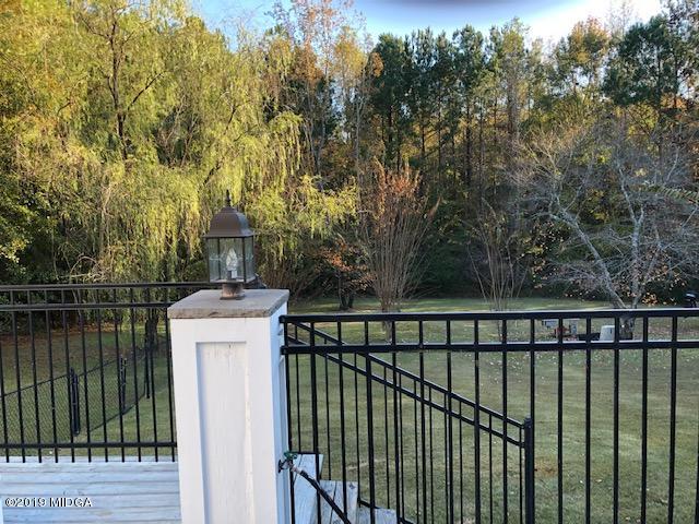 577 Old Popes Ferry Road Juliette, GA 31046 - Photo 43 of 49 a view of a balcony with wooden floor and fence