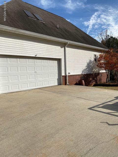 577 Old Popes Ferry Road Juliette, GA 31046 - Photo 45 of 49 a view of garage and car parked