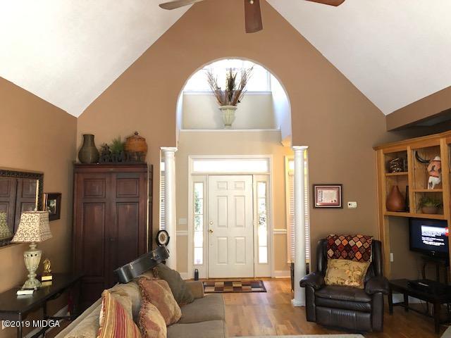 577 Old Popes Ferry Road Juliette, GA 31046 - Photo 6 of 49 a living room with furniture and wooden floor