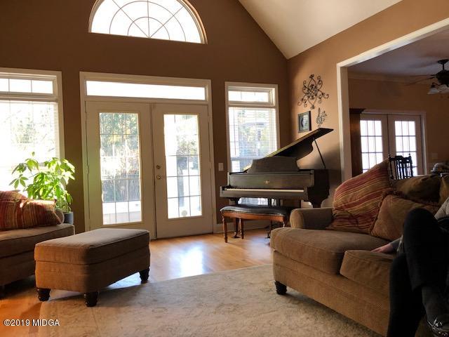 577 Old Popes Ferry Road Juliette, GA 31046 - Photo 7 of 49 a living room with furniture and a large window
