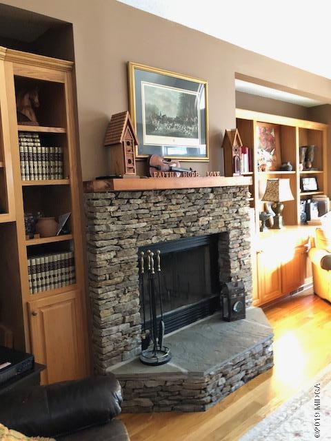 577 Old Popes Ferry Road Juliette, GA 31046 - Photo 8 of 49 a living room with furniture and a fireplace