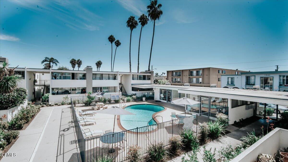 an aerial view of a house with a garden and plants