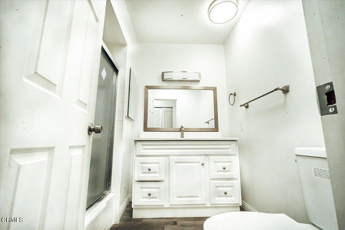 1361 Edgewood Way, Unit 61 Oxnard, CA 93030 - Photo 11 of 22 a bathroom with a sink a toilet and a mirror