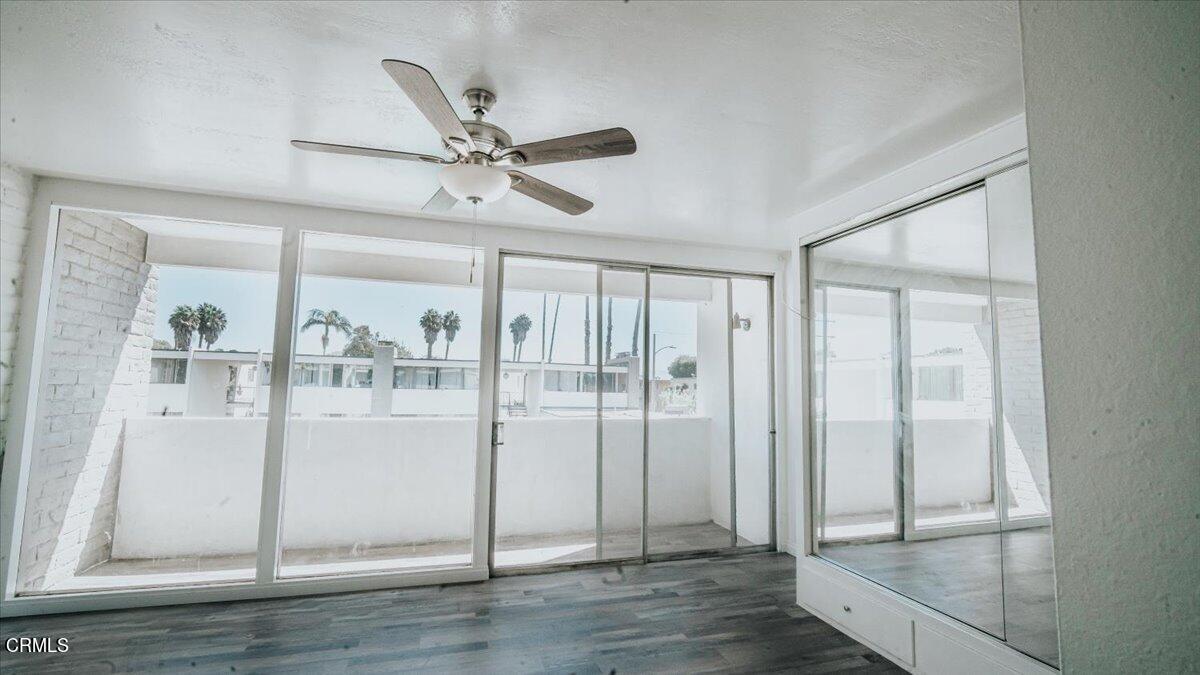 1361 Edgewood Way, Unit 61 Oxnard, CA 93030 - Photo 16 of 22 a view of empty room with wooden floor and fan