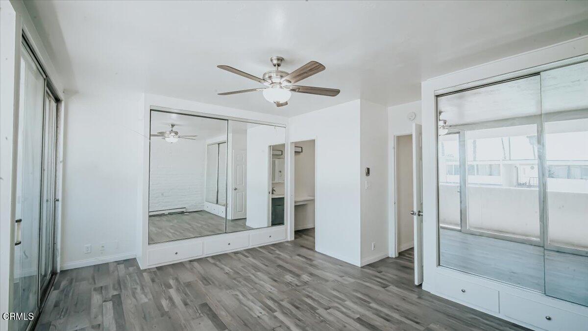 1361 Edgewood Way, Unit 61 Oxnard, CA 93030 - Photo 18 of 22 a view of empty room with wooden floor and fan