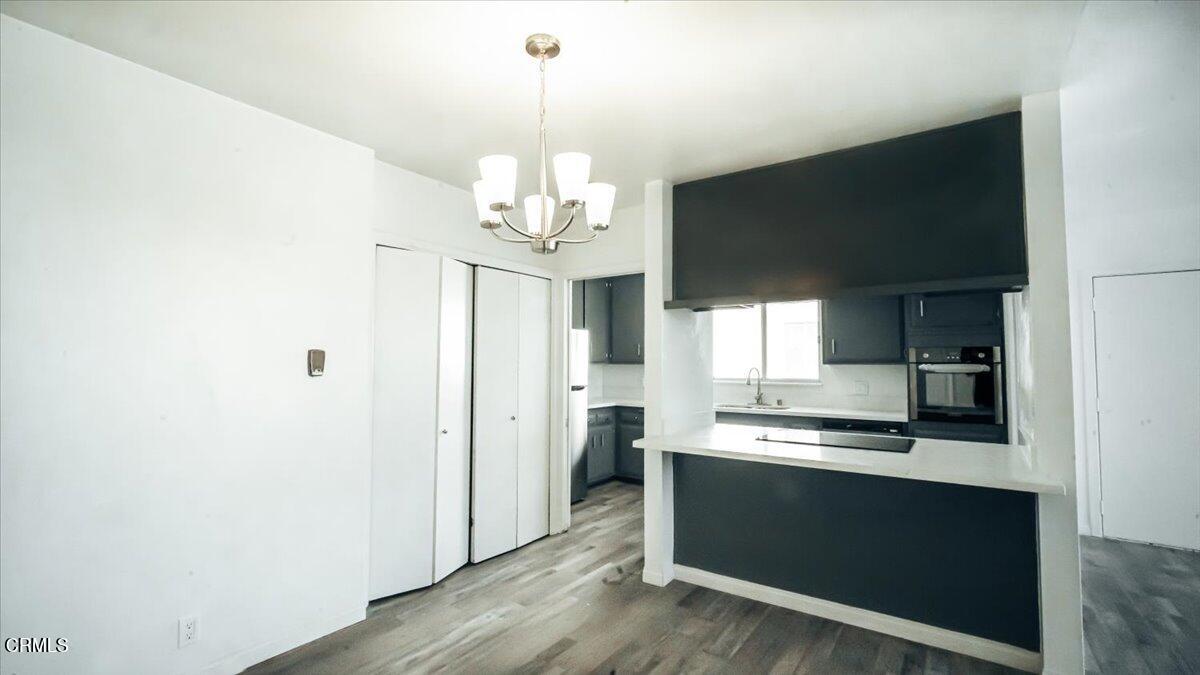 1361 Edgewood Way, Unit 61 Oxnard, CA 93030 - Photo 4 of 22 a kitchen with stainless steel appliances a refrigerator and a sink