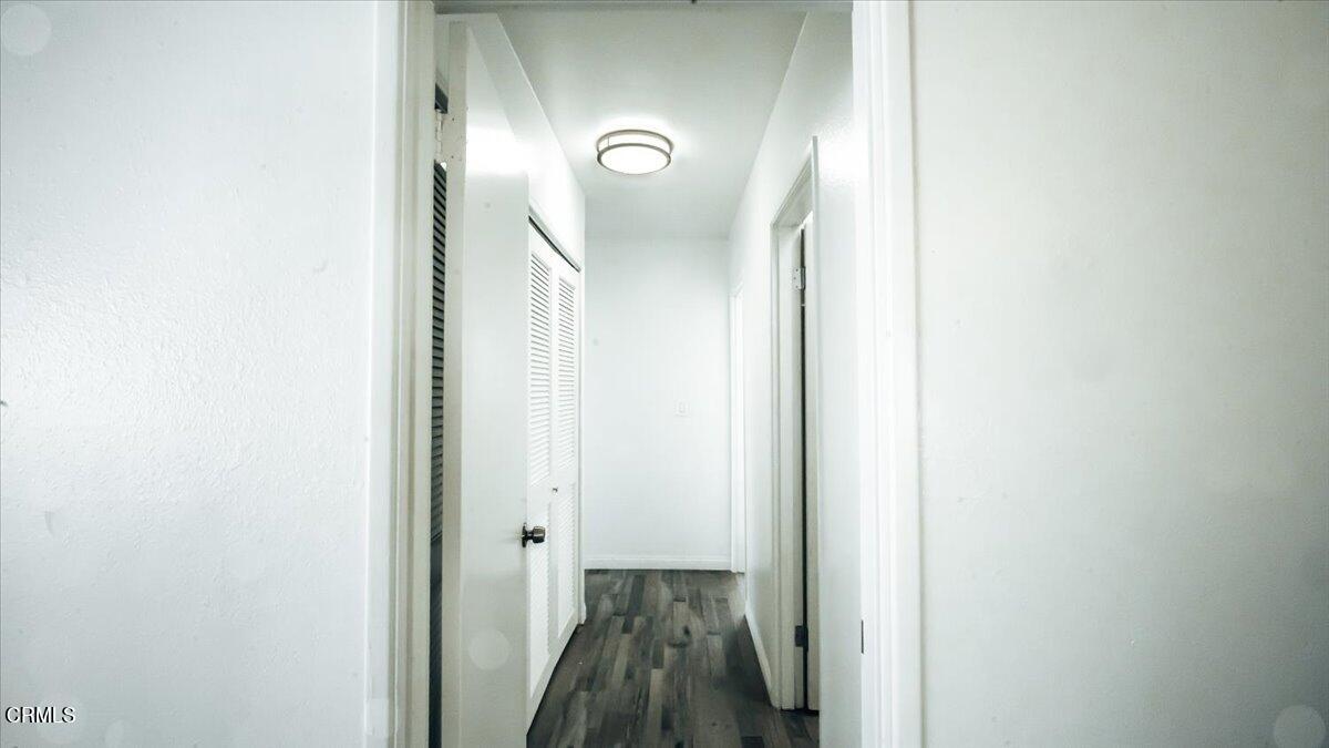 1361 Edgewood Way, Unit 61 Oxnard, CA 93030 - Photo 10 of 22 a view of a hallway with wooden floor