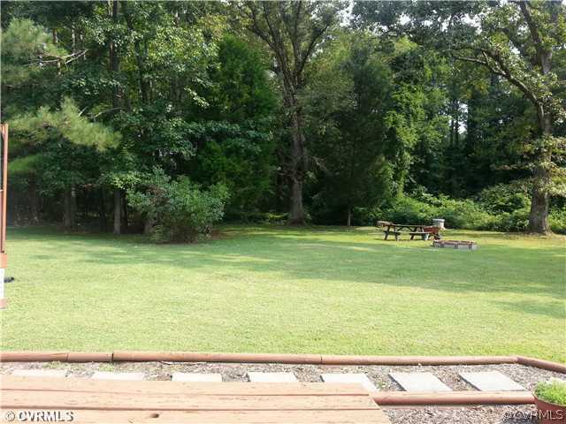 27518 Flank Road Petersburg, VA 23805 - Photo 12 of 24 Yard/Garden - The back yard is shaded by mature tr