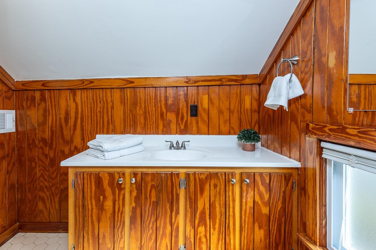 627 Watson Street Memphis, TN 38111 - Photo 11 of 35 a bathroom with a shower curtain and a sink