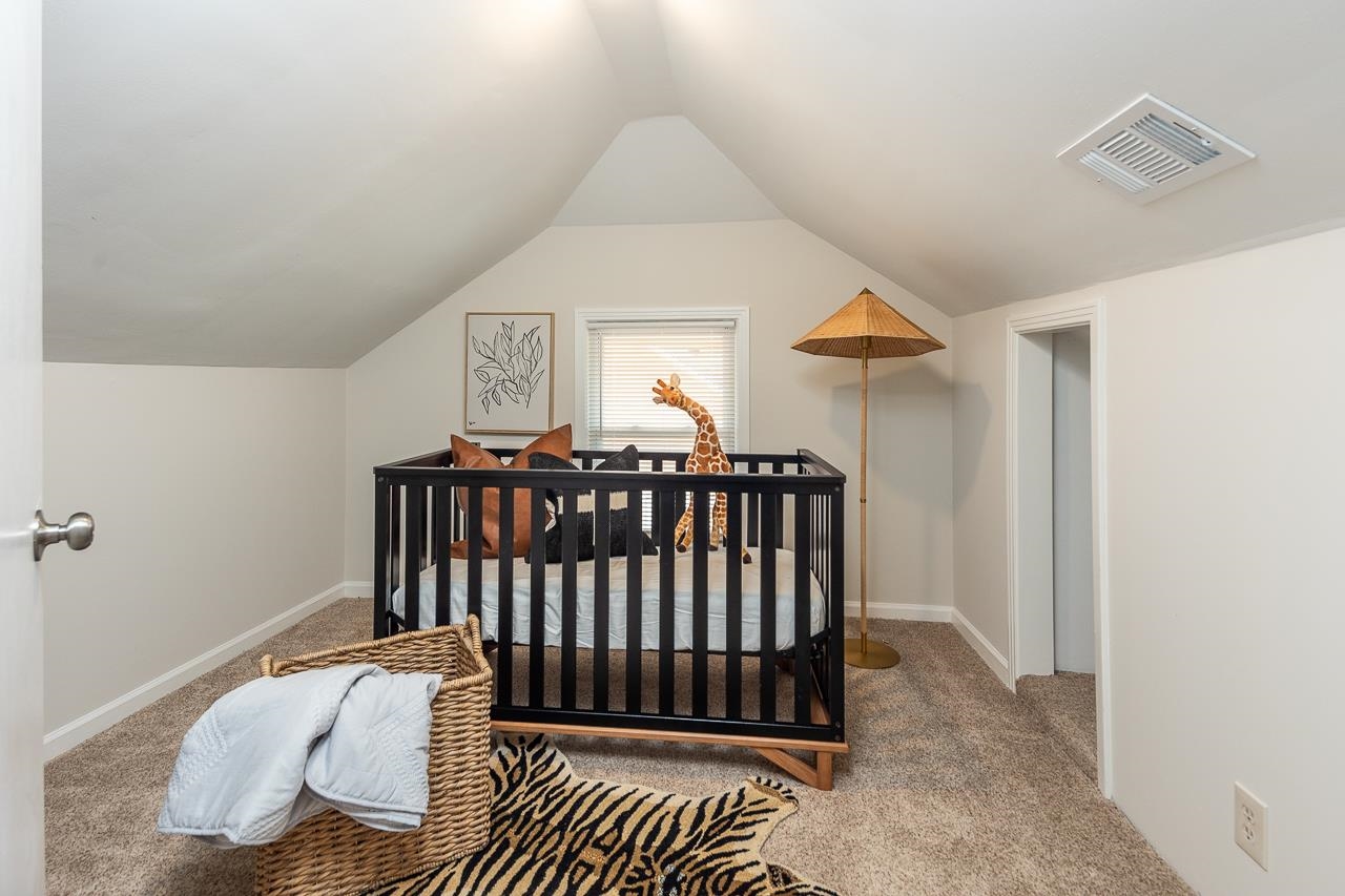 627 Watson Street Memphis, TN 38111 - Photo 13 of 35 a bedroom with a bed and a window