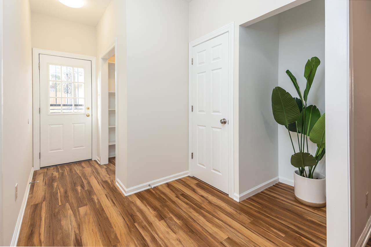 627 Watson Street Memphis, TN 38111 - Photo 20 of 35 a view of empty room with wooden floor and plant