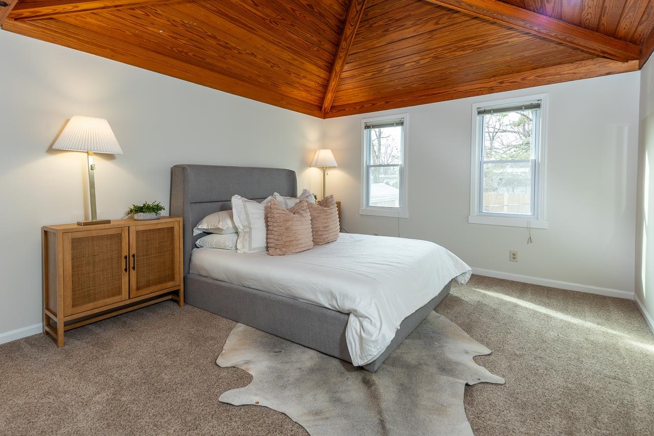 627 Watson Street Memphis, TN 38111 - Photo 2 of 35 a spacious bedroom with a bed and a lamp