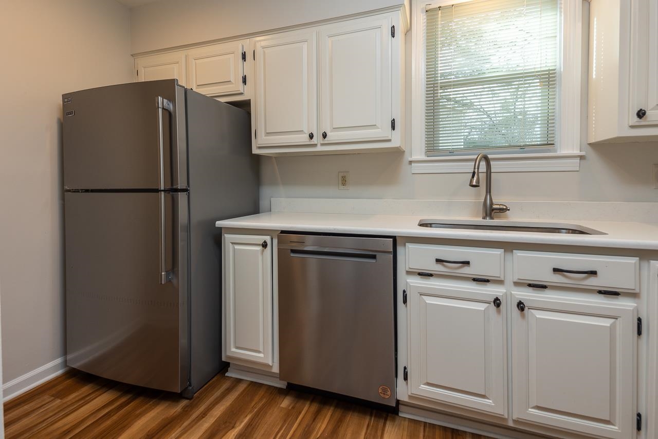627 Watson Street Memphis, TN 38111 - Photo 8 of 35 a kitchen with cabinets and a refrigerator