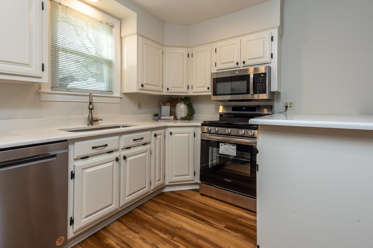 627 Watson Street Memphis, TN 38111 - Photo 9 of 35 a kitchen with stainless steel appliances white cabinets and a sink