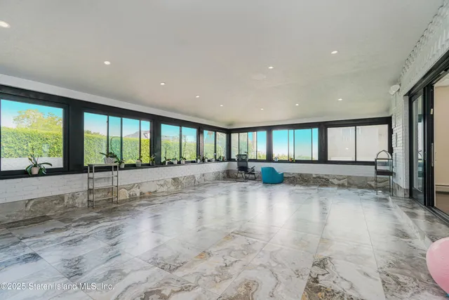 a kitchen with stainless steel appliances granite countertop a sink and a white cabinets