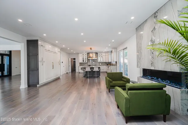 a front view of a house with fountain and entertaining space