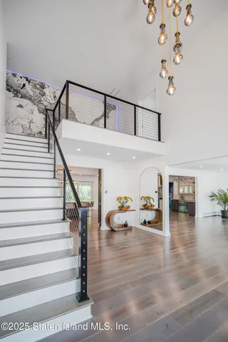 a view of a workspace with furniture and a potted plant