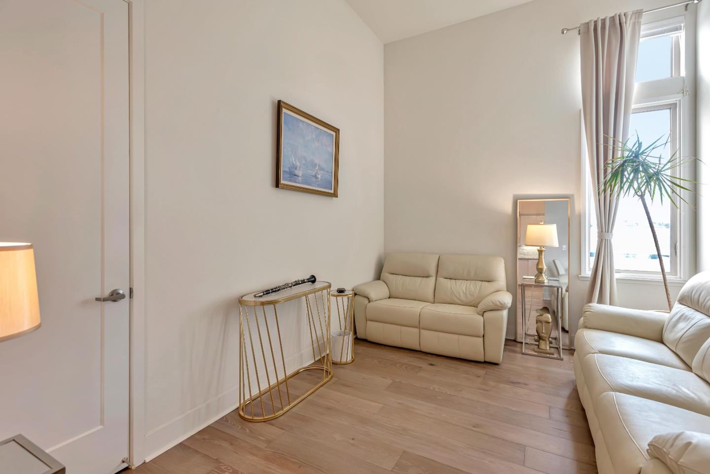 1038 Foster Square Lane, Unit 403 Foster City, CA 94404 - Photo 14 of 28 a living room with furniture and a window
