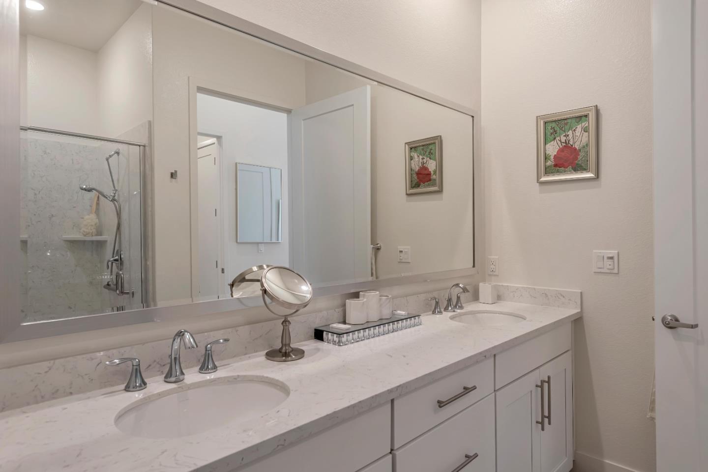 1038 Foster Square Lane, Unit 403 Foster City, CA 94404 - Photo 21 of 28 a bathroom with double sink and a mirror