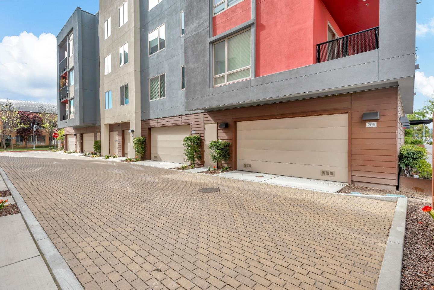 1038 Foster Square Lane, Unit 403 Foster City, CA 94404 - Photo 24 of 28 a front view of a building with a road