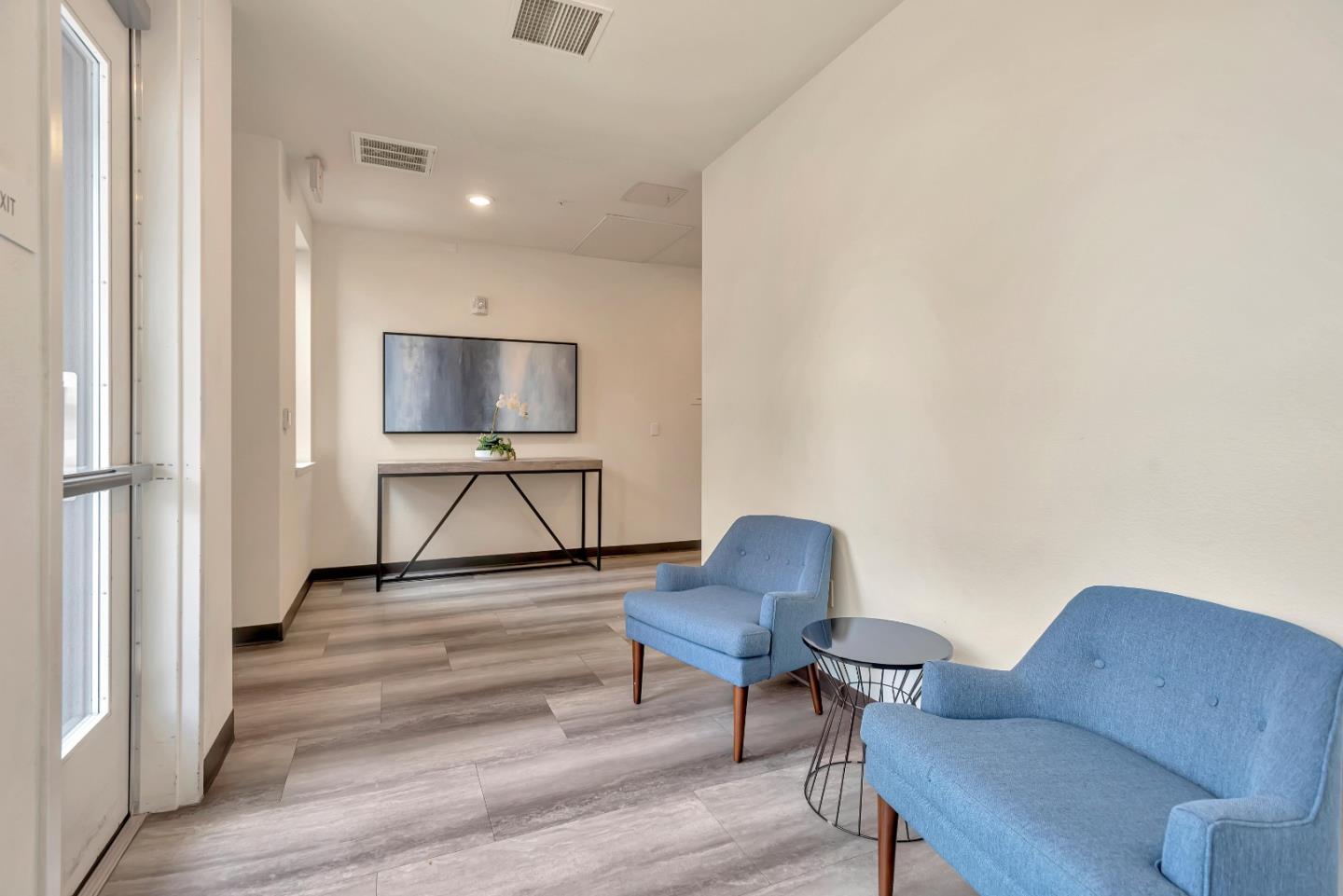 1038 Foster Square Lane, Unit 403 Foster City, CA 94404 - Photo 3 of 28 a living room with furniture and a chair