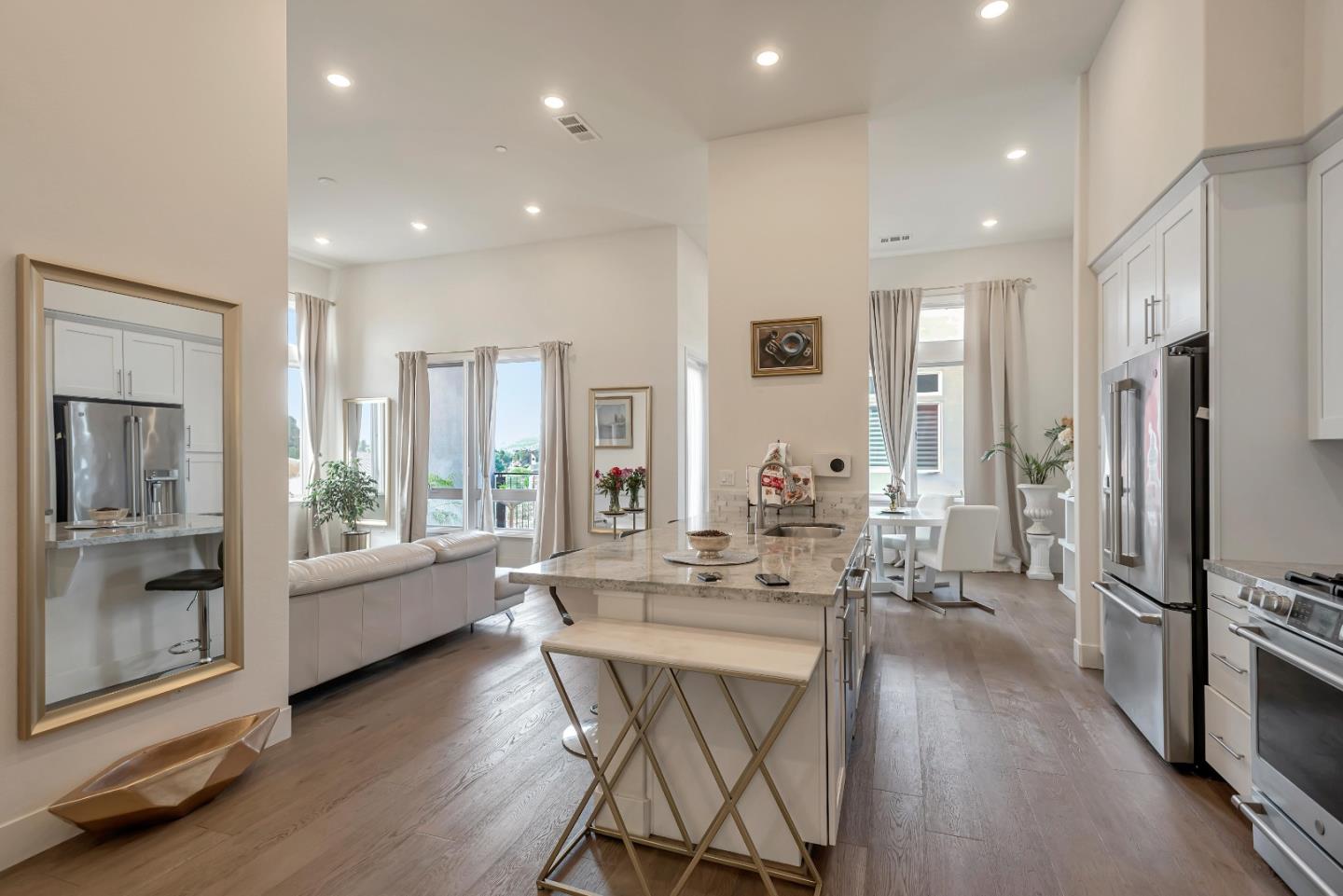 1038 Foster Square Lane, Unit 403 Foster City, CA 94404 - Photo 4 of 28 a view of a dining room with furniture window and wooden floor