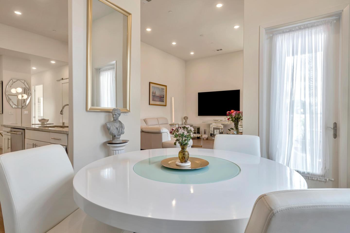 1038 Foster Square Lane, Unit 403 Foster City, CA 94404 - Photo 9 of 28 a view of a dining room with furniture