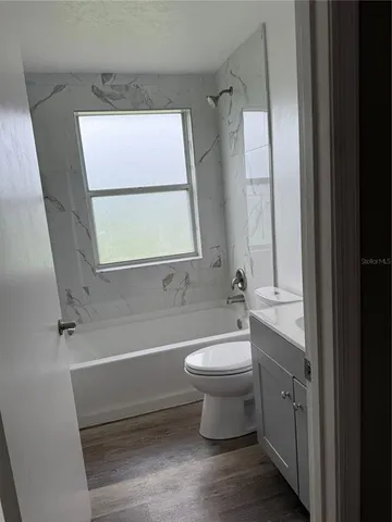 a bathroom with a sink a toilet and a bathtub