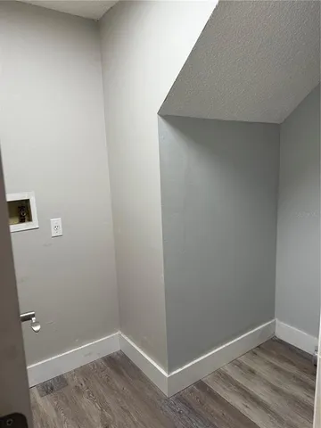 a view of small space with wooden floor