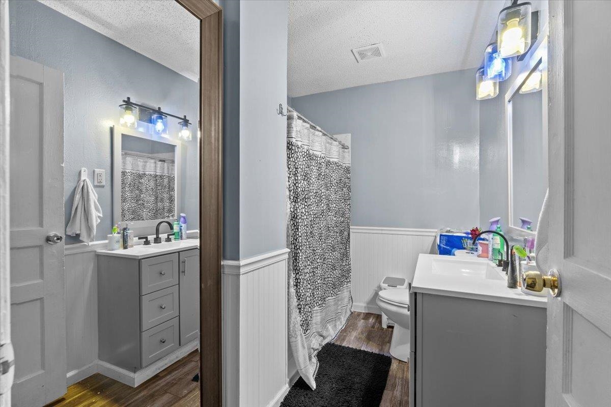3743 Given Avenue Memphis, TN 38122 - Photo 15 of 19 a bathroom with a sink mirror toilet and next to a window