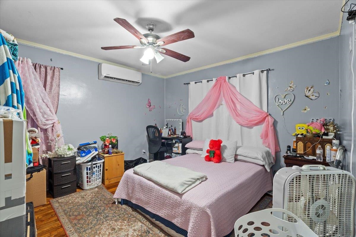 3743 Given Avenue Memphis, TN 38122 - Photo 10 of 19 a bedroom with bed and a chandelier