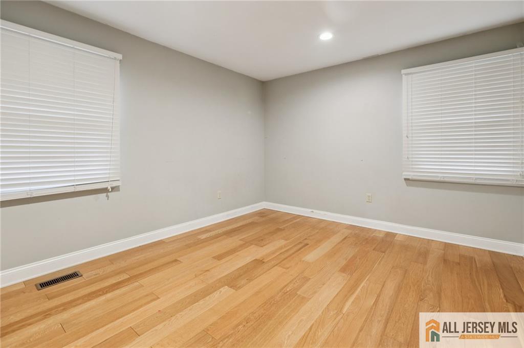 1 Landry Road Somerset, NJ 08873 - Photo 14 of 17 a view of empty room with wooden floor