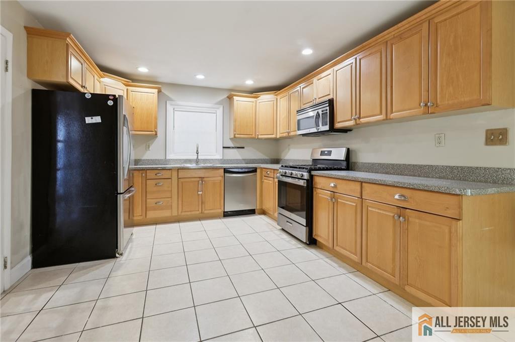1 Landry Road Somerset, NJ 08873 - Photo 7 of 17 a kitchen with stainless steel appliances granite countertop a refrigerator and a sink