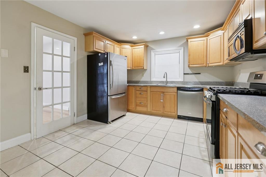 1 Landry Road Somerset, NJ 08873 - Photo 8 of 17 a kitchen with stainless steel appliances granite countertop a refrigerator sink and cabinets