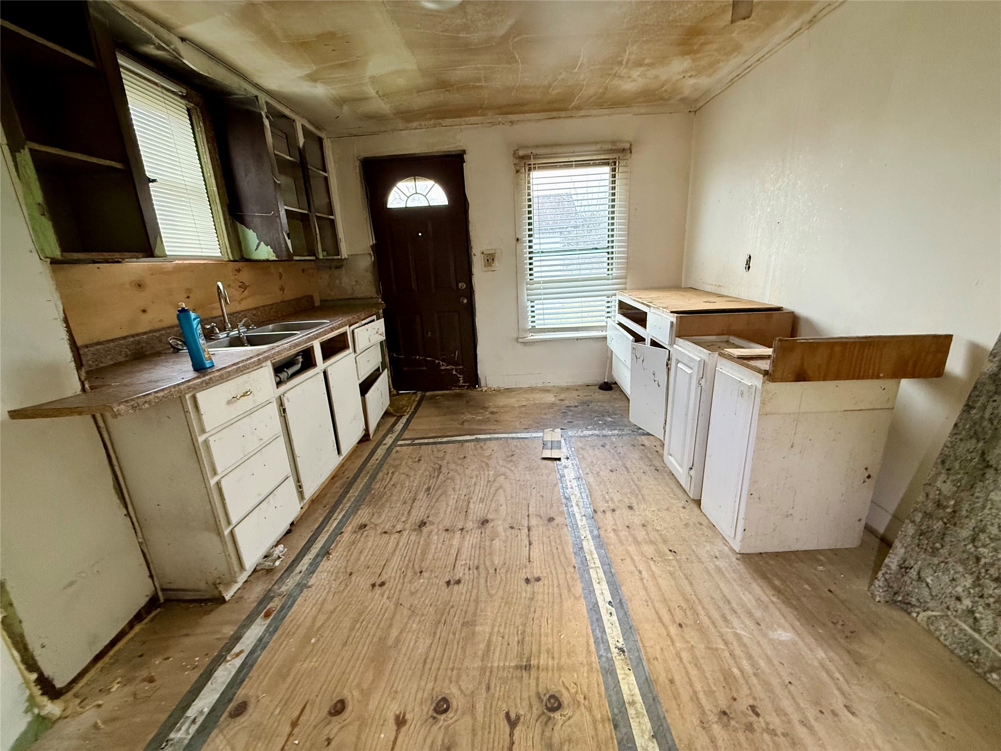 2405 Mann Street Houston, TX 77093 - Photo 8 of 14 a kitchen with granite countertop a sink and a stove top oven