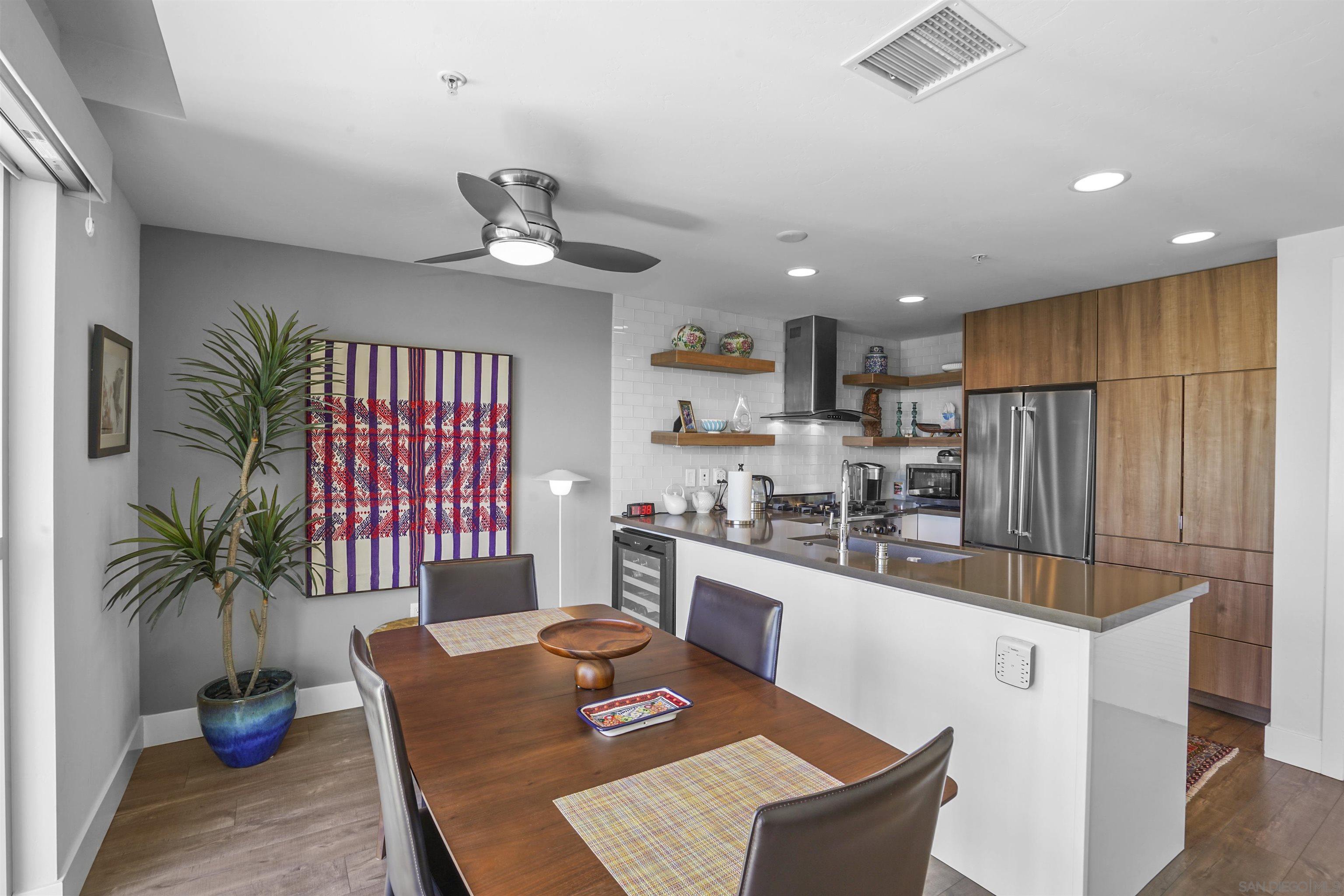 3812 Park Boulevard, Unit 503 San Diego, CA 92103 - Photo 1 of 27 a kitchen with stainless steel appliances granite countertop sink stove top oven and cabinets