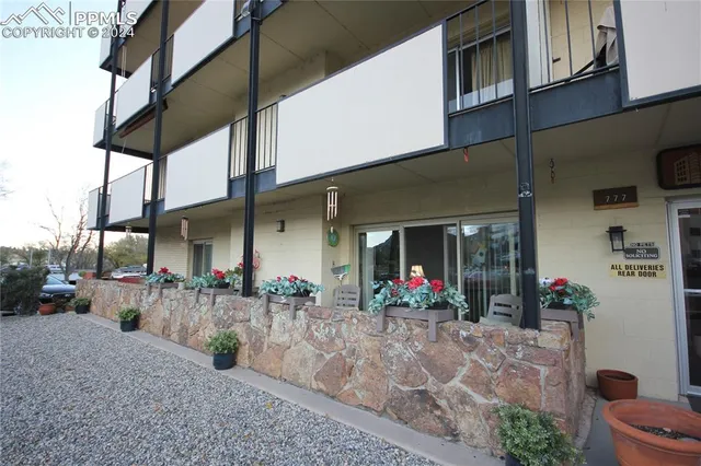 a group of people sitting in front of building