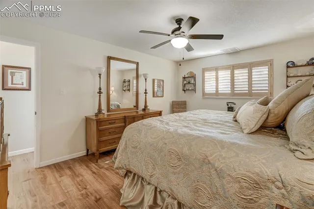 a bedroom with a bed and a table