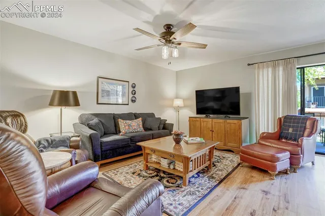 a kitchen with stainless steel appliances granite countertop a kitchen island a stove a table and chairs