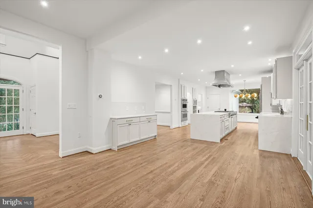 a view of kitchen with cabinets and wooden floor
