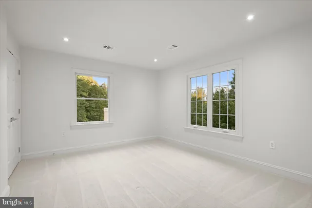 an empty room with windows