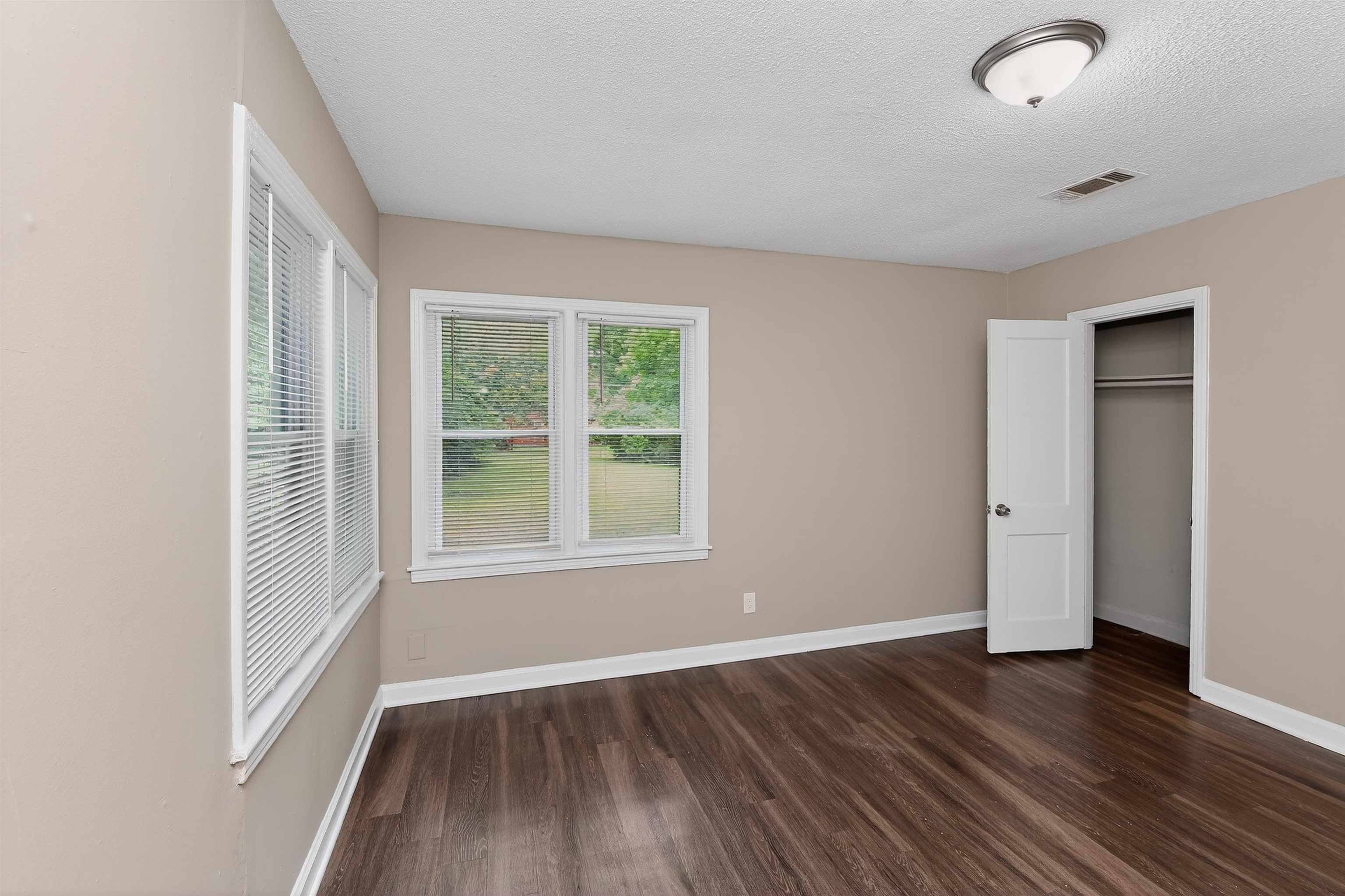 318 East Raines Road Memphis, TN 38109 - Photo 22 of 28 Interior room featuring wood-finish flooring and neutral wall tones