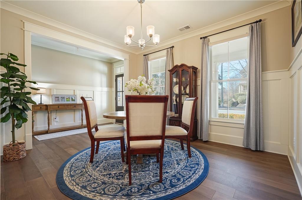 6243 Allen Ivey Road Mableton, GA 30126 - Photo 15 of 46 a view of a dining room with furniture window and wooden floor