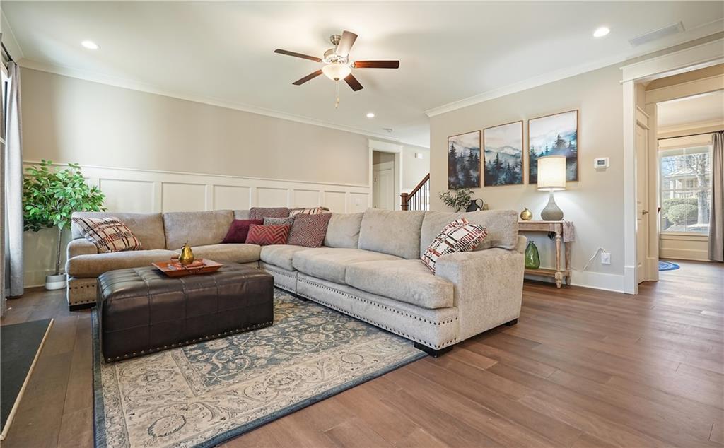 6243 Allen Ivey Road Mableton, GA 30126 - Photo 18 of 46 a living room with furniture and a chandelier