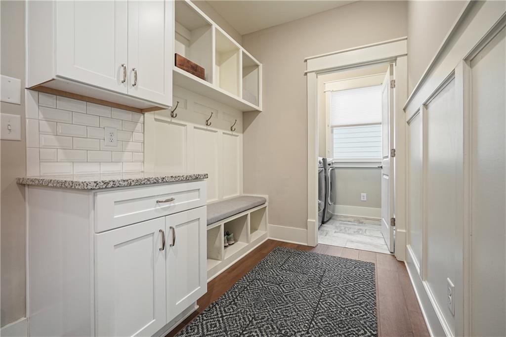6243 Allen Ivey Road Mableton, GA 30126 - Photo 19 of 46 a kitchen with white cabinets and white appliances
