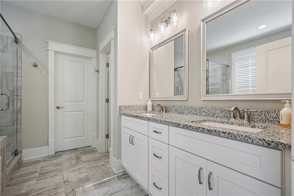 6243 Allen Ivey Road Mableton, GA 30126 - Photo 24 of 46 a bathroom with a granite countertop sink mirror and double