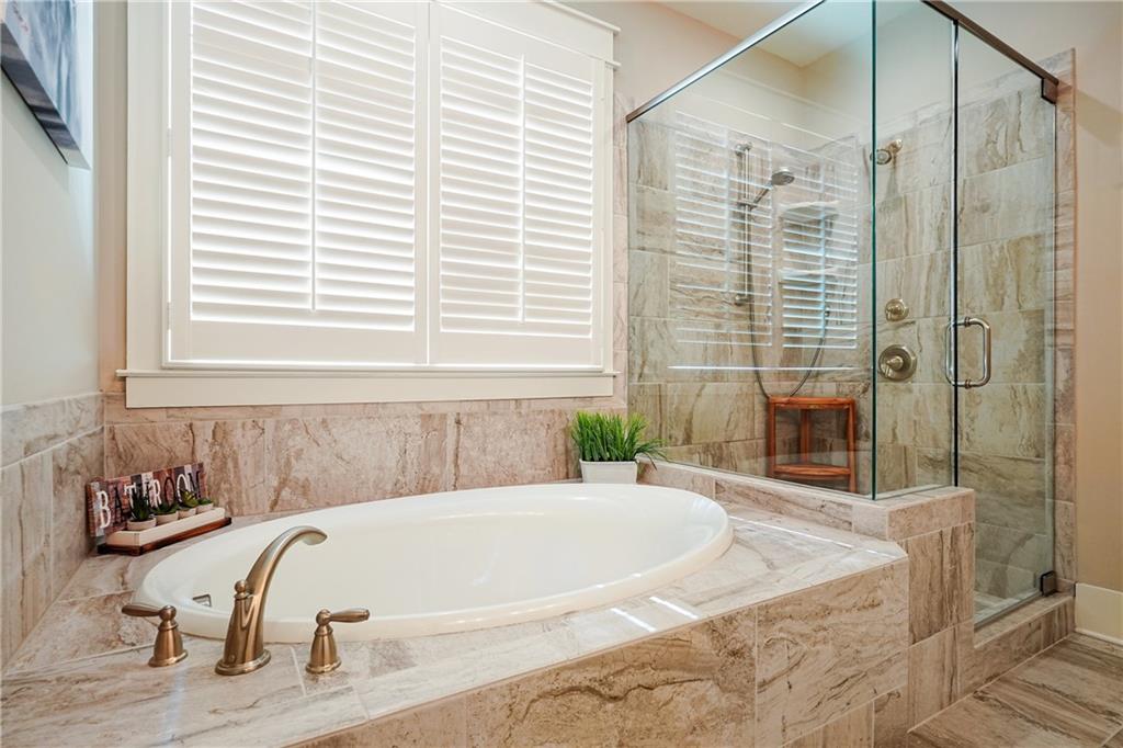 6243 Allen Ivey Road Mableton, GA 30126 - Photo 25 of 46 a bath tub sitting in a bathroom next to a tub