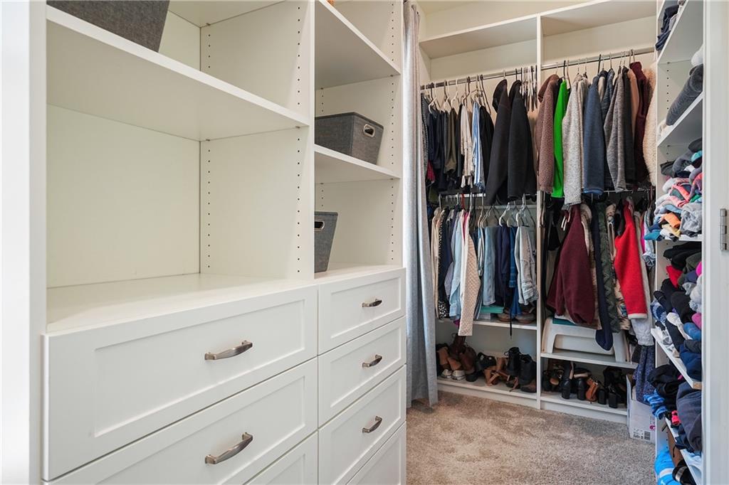 6243 Allen Ivey Road Mableton, GA 30126 - Photo 28 of 46 a view of walk in closet with clothes