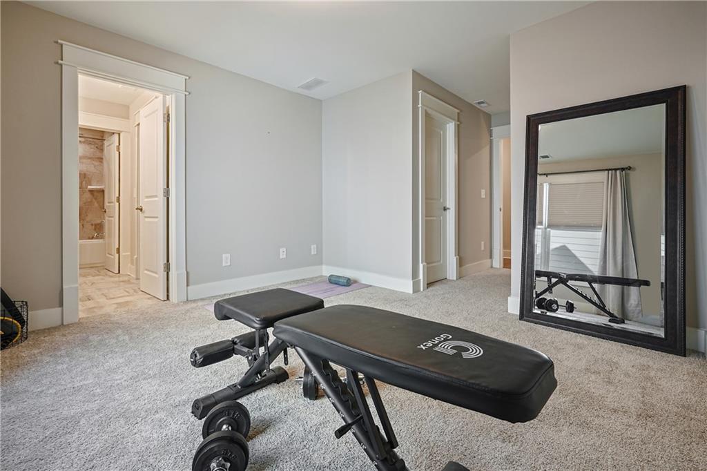6243 Allen Ivey Road Mableton, GA 30126 - Photo 34 of 46 a view of a workspace with furniture and mirror