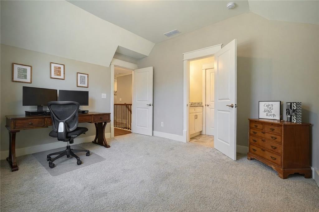 6243 Allen Ivey Road Mableton, GA 30126 - Photo 38 of 46 a view of a workspace with furniture and a bedroom